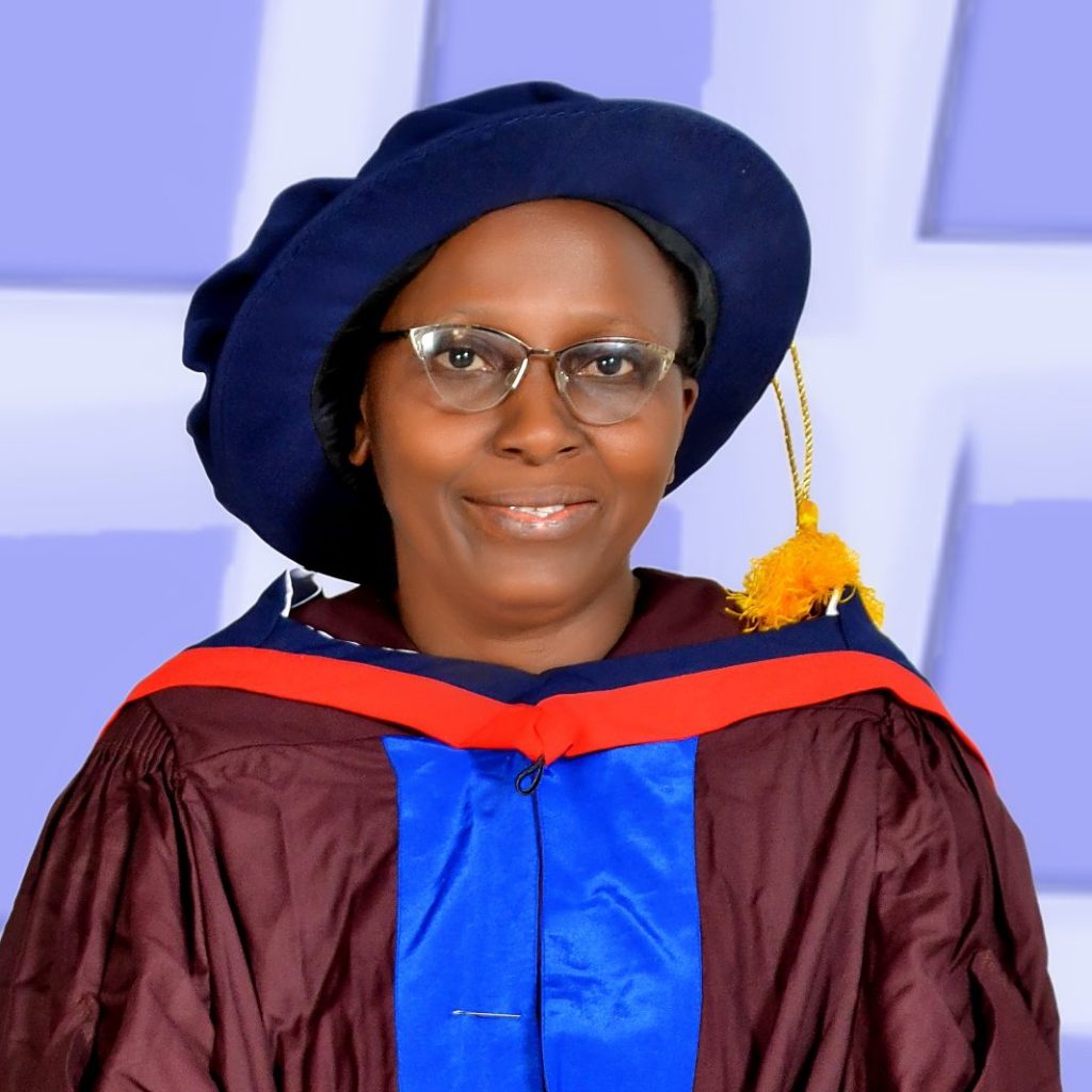 Professor Graceful Onovughe Ofodu of Ekiti State University, Nigeria. An African woman wearing a cap and gown as part of receiving her PhD
