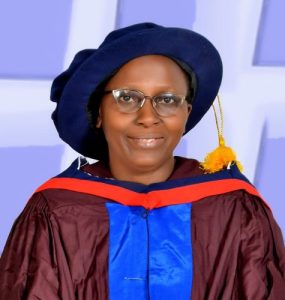 Professor Graceful Onovughe Ofodu of Ekiti State University, Nigeria. An African woman wearing a cap and gown as part of receiving her PhD